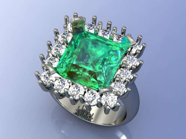 Smeraldo contornato di diamanti in oro bianco 18kt.